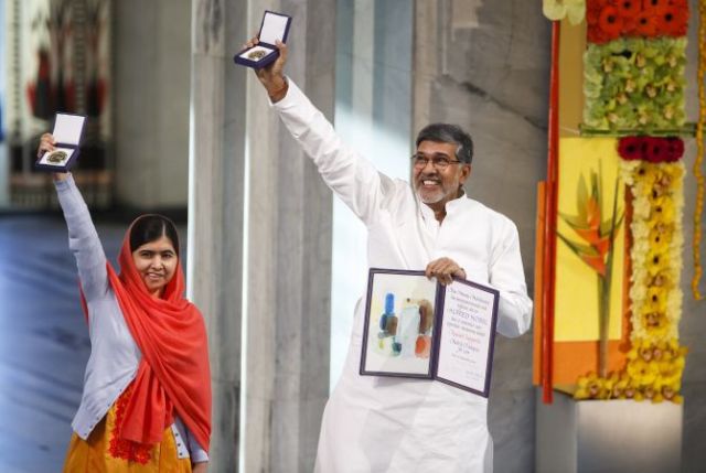 Nobel Peace Prize laureates Yousafzai and Satyarthi pose with their medals during the Nobel Peace Prize awards ceremony at the City Hall in Oslo
